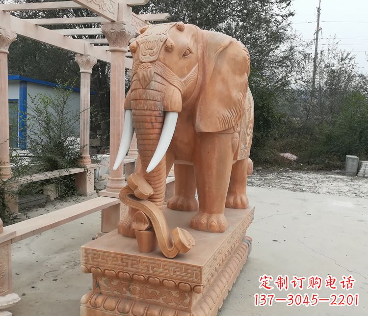 辽宁鼻卷如意的大象晚霞红门口镇宅石雕