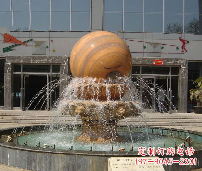 辽宁石来运转球晚霞红风水球石雕